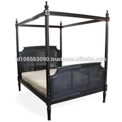 Four poster bed with rattan