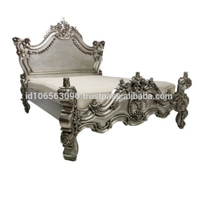 Valbone bed with silver leaf antique carved